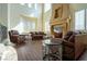 Bright and airy living room with large windows, fireplace, and comfortable seating at 861 Majestic Ridge Ct, Henderson, NV 89052