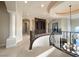 Upstairs loft area featuring a built-in bookcase and decorative wrought iron railing at 861 Majestic Ridge Ct, Henderson, NV 89052