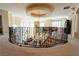 Open loft area with wrought iron railing overlooking lower level, flooded with natural light at 861 Majestic Ridge Ct, Henderson, NV 89052