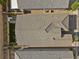 Aerial view of the property showcasing the well-maintained roof, private backyard, and surrounding neighborhood at 8705 Fordster St, Las Vegas, NV 89166