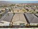 Drone shot showing the property's layout, backyard patio, and proximity to nearby homes and amenities at 8705 Fordster St, Las Vegas, NV 89166