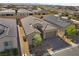 Overhead shot of the property featuring a well-kept roof, landscaped yard, and attached two-car garage at 8705 Fordster St, Las Vegas, NV 89166