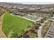 Aerial view of a community park with large open field and a basketball court at 8705 Fordster St, Las Vegas, NV 89166