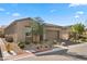 Charming single-story home features desert landscaping, a brick driveway, and a tile roof at 8705 Fordster St, Las Vegas, NV 89166