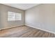 Bedroom featuring wood-look flooring, natural light and neutral paint at 8725 W Flamingo Rd # 208, Las Vegas, NV 89147