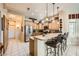 Bright and airy kitchen with granite counters, stainless steel appliances, and breakfast bar at 9145 Villa Ridge Dr, Las Vegas, NV 89134