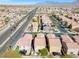 Overhead shot of a residential neighborhood with palm-lined streets and mountain views at 9171 Denver Sky Ave, Las Vegas, NV 89149
