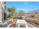 Private patio area with a seating area and a well-maintained garden with privacy fence at 9171 Denver Sky Ave, Las Vegas, NV 89149