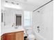 Clean bathroom with white shower and bathtub combination with wood flooring and a window providing natural light at 9171 Denver Sky Ave, Las Vegas, NV 89149