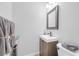 Stylish bathroom vanity, sleek modern sink, beautiful mirror and attractive tile flooring at 9171 Denver Sky Ave, Las Vegas, NV 89149