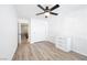 Bright bedroom with wood flooring, closet, and a ceiling fan, offering comfort and style at 9171 Denver Sky Ave, Las Vegas, NV 89149