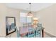 Charming dining room with table and chairs illuminated by natural light at 9171 Denver Sky Ave, Las Vegas, NV 89149