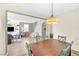 The dining room features modern lighting and a view through to the living area at 9171 Denver Sky Ave, Las Vegas, NV 89149