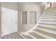 Bright entryway features a white front door, decorative wall niches, and staircase with light wood treads at 9171 Denver Sky Ave, Las Vegas, NV 89149