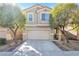 Charming two-story home with a well-manicured front yard and an attached two-car garage at 9171 Denver Sky Ave, Las Vegas, NV 89149