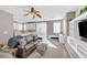 Bright living space with a ceiling fan, hardwood floors, and a clear view of the kitchen area at 9171 Denver Sky Ave, Las Vegas, NV 89149