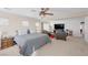 Large main bedroom with a sitting area featuring a ceiling fan and ample natural light at 9171 Denver Sky Ave, Las Vegas, NV 89149