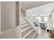 Staircase leading to a bright living space with natural light and comfortable seating at 9171 Denver Sky Ave, Las Vegas, NV 89149