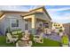 Cozy backyard oasis with a fire pit, patio seating, and manicured landscaping at 924 Mayfield Manor Ln, Las Vegas, NV 89138