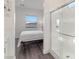 Bright bathroom with glass shower, with a view to the bedroom with outside views at 924 Mayfield Manor Ln, Las Vegas, NV 89138