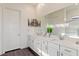 Bright bathroom features a double sink vanity with framed mirror and chrome hardware throughout at 924 Mayfield Manor Ln, Las Vegas, NV 89138