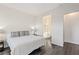 Bedroom with hardwood floors and ensuite bathroom entrance, providing a comfortable, private space at 924 Mayfield Manor Ln, Las Vegas, NV 89138
