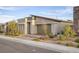 Contemporary home showcasing clean lines, low-maintenance landscaping, and an attached garage at 924 Mayfield Manor Ln, Las Vegas, NV 89138