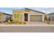 Charming home featuring modern architectural elements and a manicured front yard at 924 Mayfield Manor Ln, Las Vegas, NV 89138