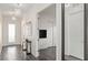 Hallway with wood floors, modern light fixtures, leading to other rooms at 924 Mayfield Manor Ln, Las Vegas, NV 89138