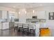 Modern kitchen with white cabinets, stainless steel appliances, and a spacious island at 924 Mayfield Manor Ln, Las Vegas, NV 89138