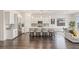 Well-designed kitchen featuring white cabinetry, stainless steel appliances, and an island with barstool seating at 924 Mayfield Manor Ln, Las Vegas, NV 89138