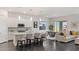 Open-concept kitchen featuring a large island with seating and seamless flow to the living area at 924 Mayfield Manor Ln, Las Vegas, NV 89138