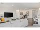 Bright, open-concept living room featuring modern decor and sleek dark hardwood flooring at 924 Mayfield Manor Ln, Las Vegas, NV 89138