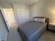 Neutral bedroom features a comfortable bed and closet storage at 9328 Jumpin Juniper Ave, Las Vegas, NV 89129
