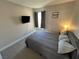 Bedroom features a comfortable bed and a wall-mounted television at 9328 Jumpin Juniper Ave, Las Vegas, NV 89129
