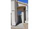 A lovely house front with a modern door and desert landscaping for low maintenance appeal at 9328 Jumpin Juniper Ave, Las Vegas, NV 89129