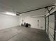 Spacious two-car garage featuring ample storage and a convenient automatic door opener at 9328 Jumpin Juniper Ave, Las Vegas, NV 89129
