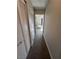 Hallway leading to bright bedroom, with a desk, chair and large window at 9328 Jumpin Juniper Ave, Las Vegas, NV 89129
