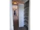 Hallway with a carpeted floor and built in closet with folding doors at 9328 Jumpin Juniper Ave, Las Vegas, NV 89129