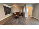 Cozy living room featuring a decorative rug, contemporary furniture, and hardwood floors at 9328 Jumpin Juniper Ave, Las Vegas, NV 89129
