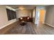 Living room featuring hardwood floors, a decorative rug, and modern furniture at 9328 Jumpin Juniper Ave, Las Vegas, NV 89129