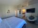 A bright main bedroom features an open doorway to the bathroom and modern decor, offering a serene retreat at 9328 Jumpin Juniper Ave, Las Vegas, NV 89129