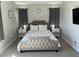 Comfortable bedroom with bed, window, side tables and television at 9328 Jumpin Juniper Ave, Las Vegas, NV 89129