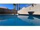 Backyard swimming pool featuring clean water and mature palm trees at 9328 Jumpin Juniper Ave, Las Vegas, NV 89129