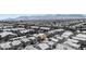Bird's eye view of a residential community featuring uniform homes against a backdrop of distant mountains at 9527 Havasu Canyon Ave, Las Vegas, NV 89166