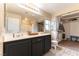 Spacious bathroom with a double sink vanity and walk in closet at 9527 Havasu Canyon Ave, Las Vegas, NV 89166