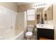 Bathroom featuring a bathtub and a toilet next to a vanity sink at 9527 Havasu Canyon Ave, Las Vegas, NV 89166