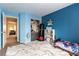 This bedroom is painted bright blue with carpet and neutral trim at 9527 Havasu Canyon Ave, Las Vegas, NV 89166