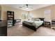 Comfortable bedroom with neutral walls, ceiling fan, and windows with natural light at 9527 Havasu Canyon Ave, Las Vegas, NV 89166