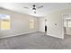Spacious carpeted bedroom features neutral walls and a ceiling fan for added comfort at 9527 Havasu Canyon Ave, Las Vegas, NV 89166